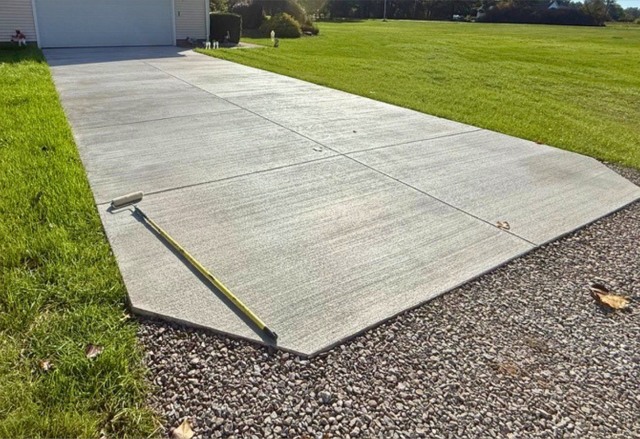 New concrete driveway toward garage