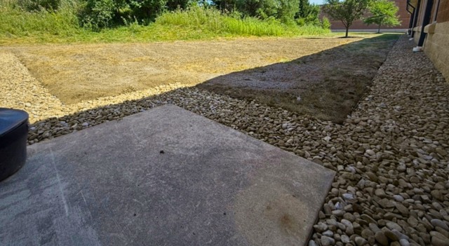 Completed rock border and drainage at side door