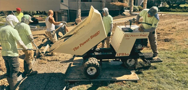 Crew using power buggy to deliver concrete
