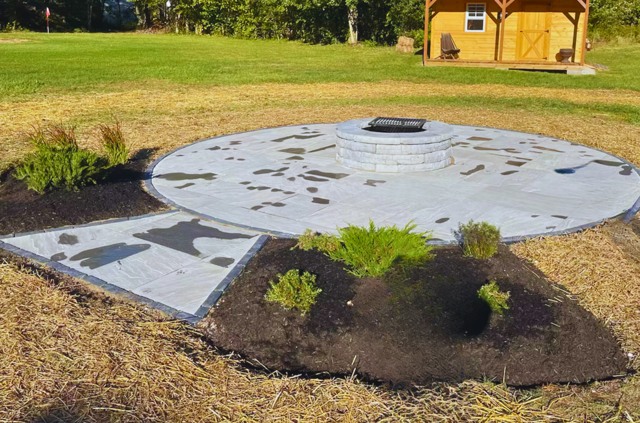 Circular firepit pad and distant shed