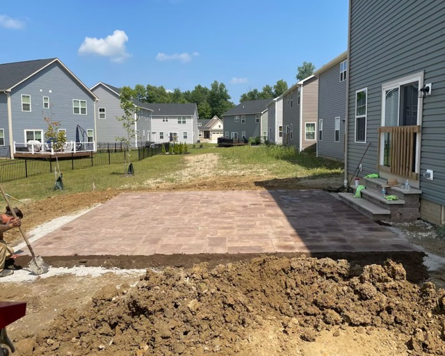 Paver patio and surrounding rough grade
