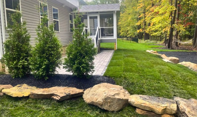 Rock border and planting beside patio
