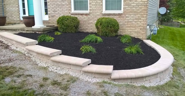 Curved block bed edging and new plants