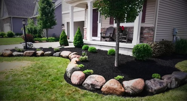 Boulder edged front planting bed
