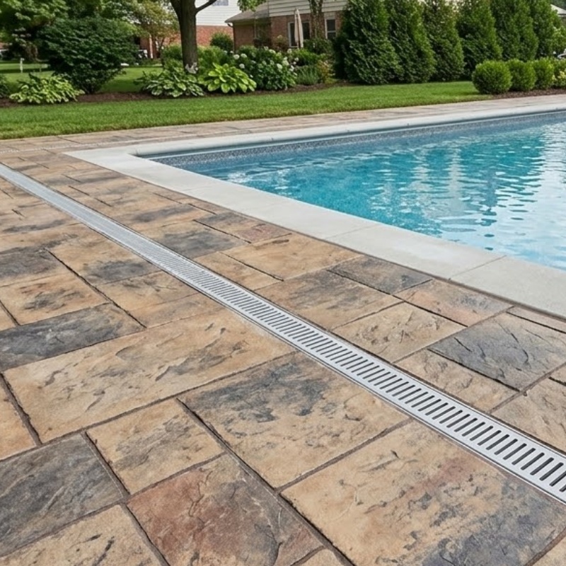 Bee Green Outdoor Living Stamped Concrete Pool Deck with Channel Drainage