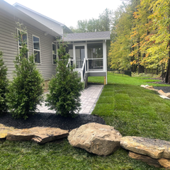 artline-pavers-with-natural-retaining-wall-to-lift-yard-up-outcroppings-sod-yard-to-finish-1