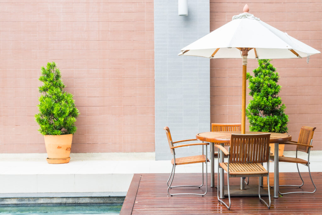 table chair with white umbrella outdoor patio