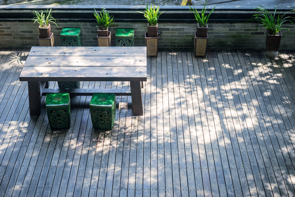 terrace with wooden table plants